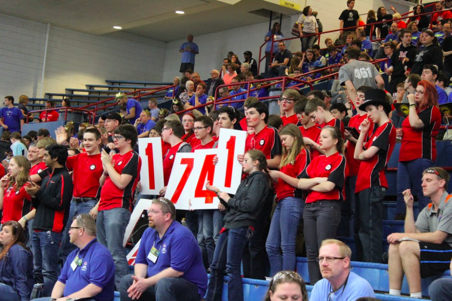 Red Alert Robotics cheers in the stands, attempting to bring the judges attention to their team.