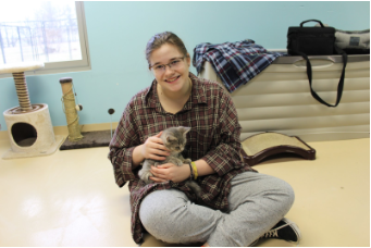 Sarah Morrow spends a lot of her time at the shelter with the cats. This kitten named Flannel was adopted shortly after their visit.