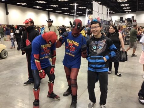 Charles Dowell stands with other attendees dressed in costume for the Indy Comic Con.