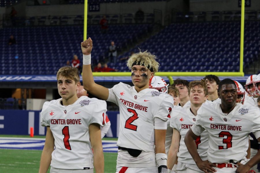Week of Nov 29: sophomore quarterback Tayven Jackson salutes fans alongside his teammates
, freshman running back Eli Holt, senior safety Elijah Owens, and others after the state final. The Trojans fell to the Carmel Greyhounds 17-20.