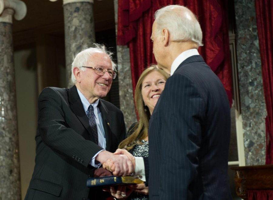 Senator Bernie Sanders and former Vice President Joe Biden shake hands in 2011.