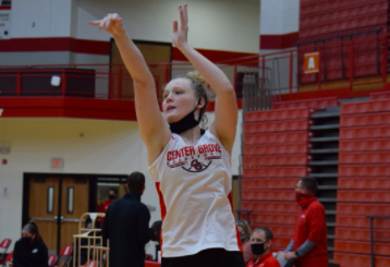 Senior Mary Wilson warms up before the teams scrimmage against Avon last Thursday.