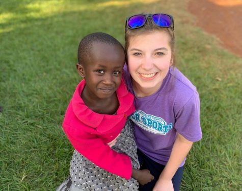 McLeish takes a photo with one of the Kenyan children she aided during her missionary work.