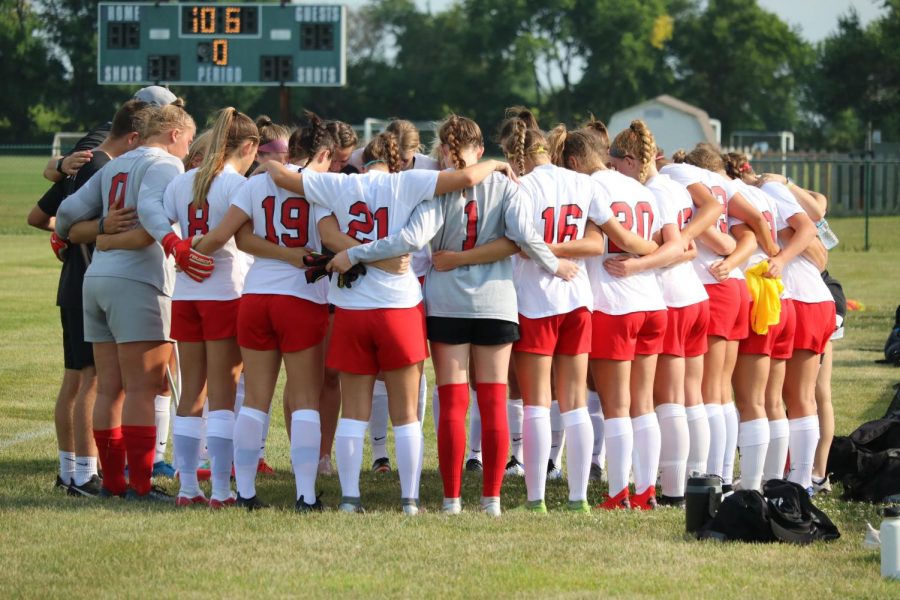 The girls soccer team huddles before its scrimmage against Zionsville last week.