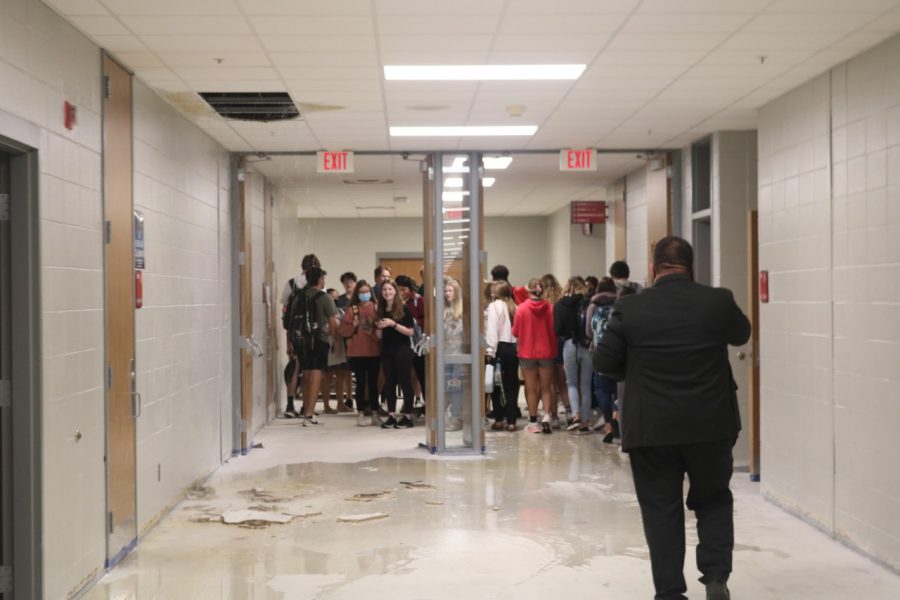 Students are evacuated from the science classrooms that began flooding during Wednesdays heavy rain.