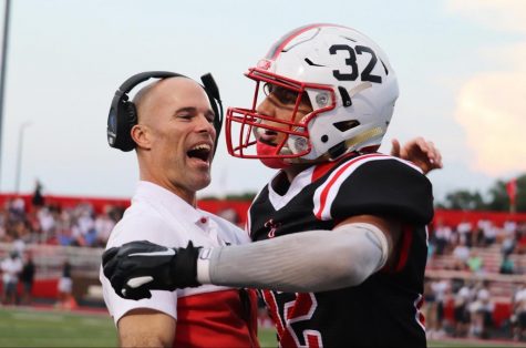 Coach Lyon Embraces James Schott after his fumble recovery in last weeks 56-7 victory over Decatur Central.