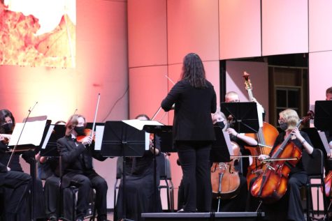 Conductor Laura Deaton conducts members of the orchestra during an October 6 performance.