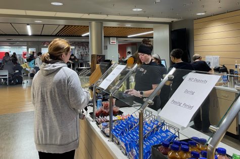 Students wait in line to order snacks and drinks from the cafe.