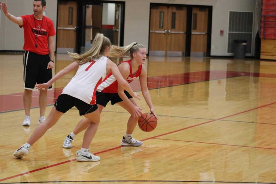 Lindsey Walker breaks through Ella Hobson to set up for a pass.