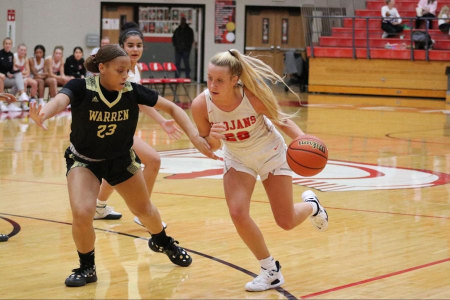 Savanna Bischoff drives to the rim on a Warren Central defender. Bischoff finished the night with 11 points, with 10 points coming in the fourth quarter guiding the Trojans to a 38-35 win.
