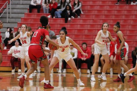 Aubrie Booker plays on ball defense at the top of the key against Lawerence North in the Trojans regular season final. 
