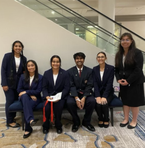 Junior Gowthamm Mandala, third from right,  poses with other executive members during the HOSA state conference. 