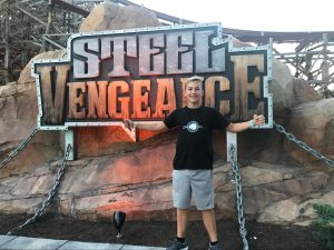 Parestich stands in front of “Steel Vengeance,” a roller coaster at Cedar Point amusement park.