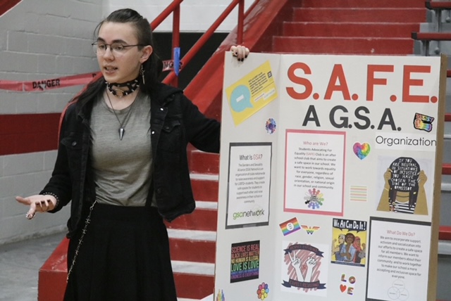 A+student+promotes+the+GSA+SAFE+club+at+the+Club+Fair+in+the+West+Gym+on+Monday.