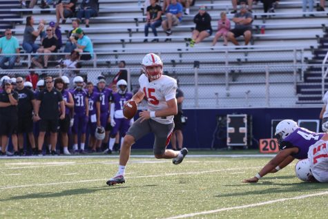 Quarterback Tyler Cherry rolls out looking for an open receiver during the teams scrimmage at Brownsburg last Friday.