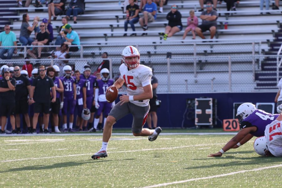 Quarterback+Tyler+Cherry+rolls+out+looking+for+an+open+receiver+during+the+teams+scrimmage+at+Brownsburg+last+Friday.