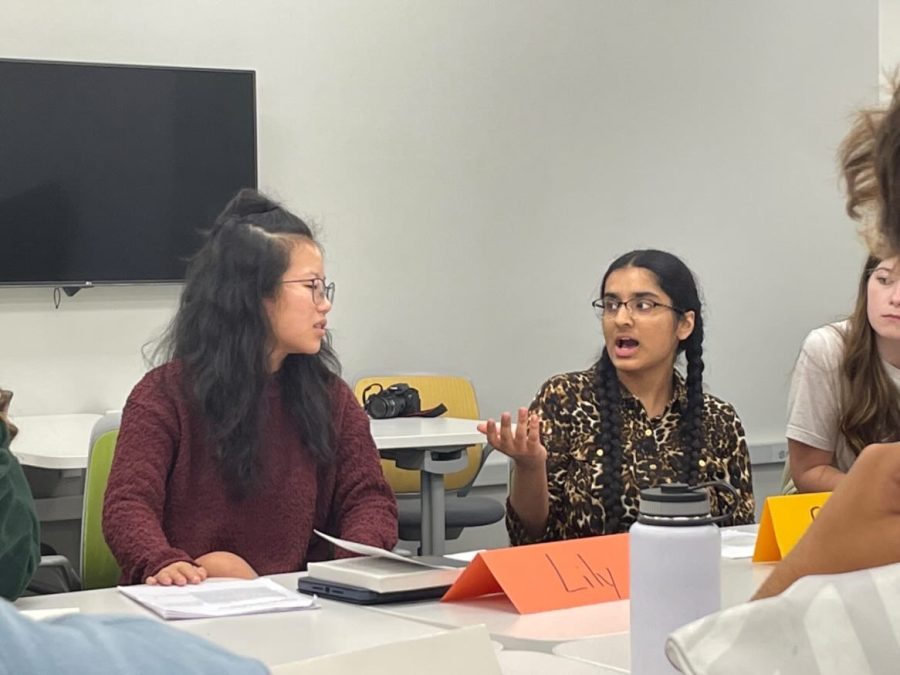 Seniors Lily Sawyer and Rahber Syeda discuss the novel “The Things They Carried” during a Socratic seminar in Josh Surface’s period 5 AP Literature class on Friday.