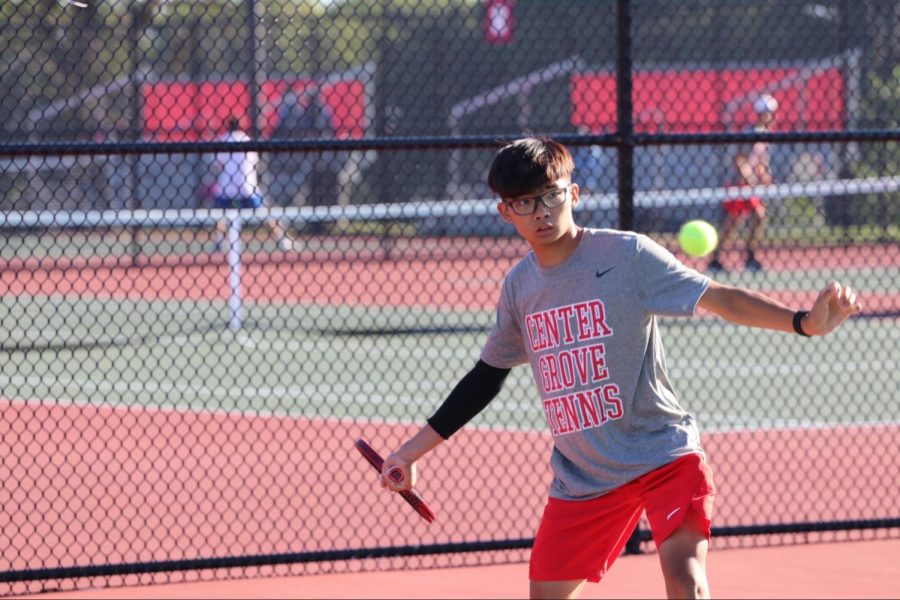 Junior Loc Pham prepares to hit a forehand shot in his match against Franklin.
