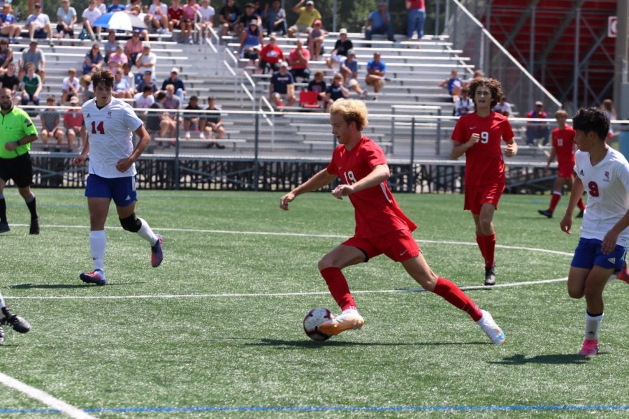 Montfort dribbles the ball during a home soccer game against Roncalli. Montfort recorded 10 goals and 5 assists during the season, earning Second Team All-State honors.