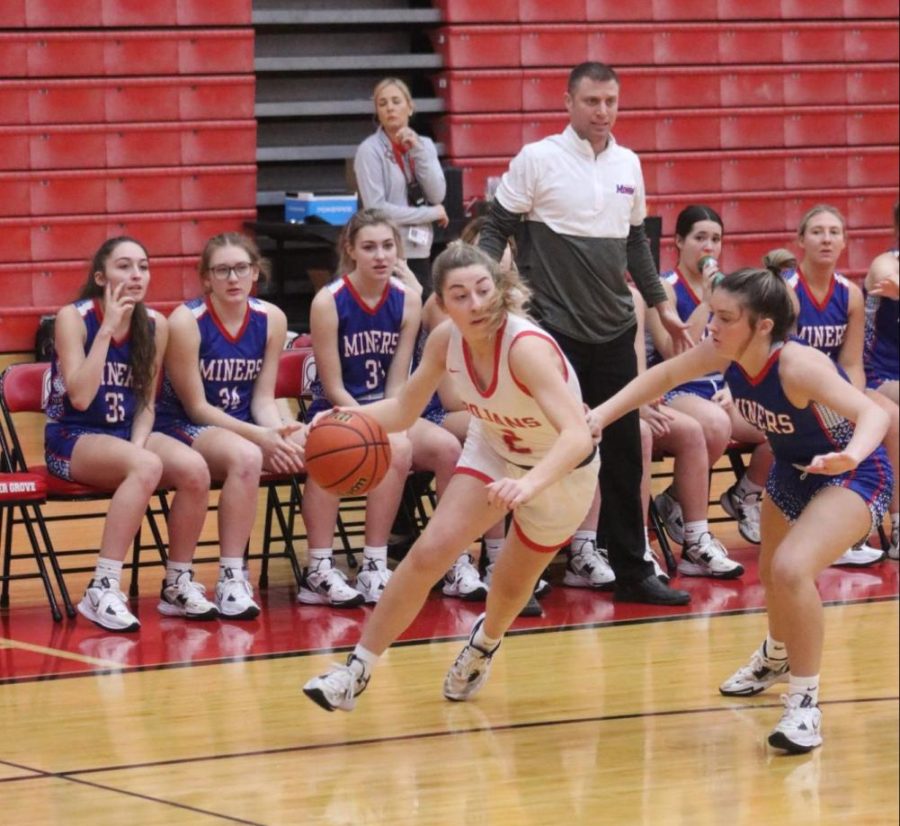 During the Carol Tumey Holiday Tournament, junior Audrey Annee drives to the basket against a Linton Stockton defender.