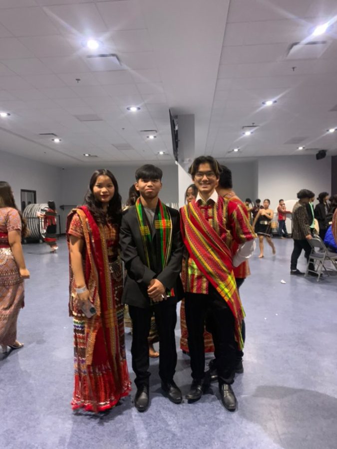 Junior Cherry Iang, Chan Kung and junior Chan Thang pose for a photo wearing traditional Chin clothing during CEBCs Chin National Day celebration on Feb. 18.