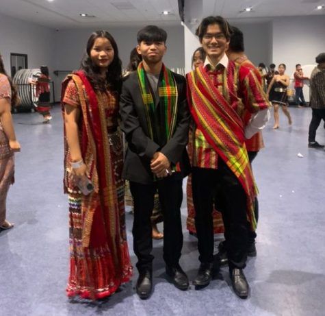 Junior Cherry Iang, Chan Kung and junior Chan Thang pose for a photo wearing traditional Chin clothing during CEBCs Chin National Day celebration on Feb. 18.