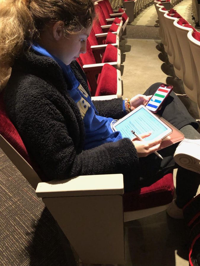 Junior Caroline Blair attempts to study during AIM in the auditorium.
