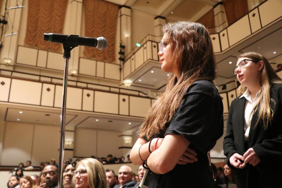 Sophomore Emily Strother stands in front of a microphone to ask a question at the Indiana Supreme Court hearing on April 11.