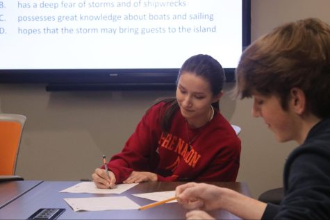Junior Isabella Dills and sophomore Lucas Plunkett attempt to answer a question during an English Academic Super Bowl practice.