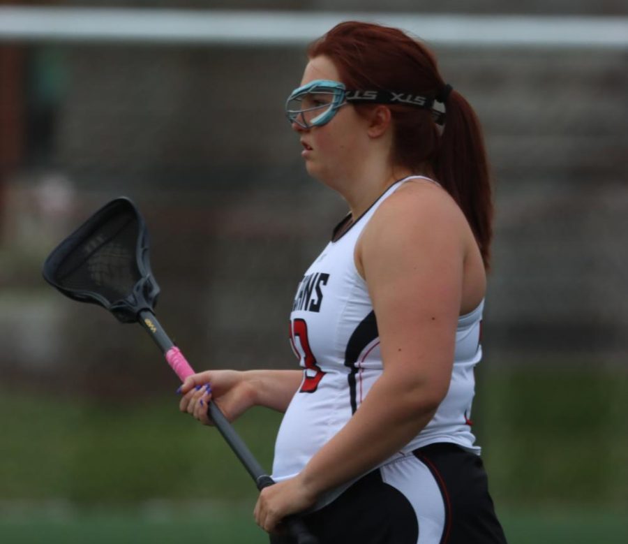 Madison+Harrigan+stands+with+her+lacrosse+stick+during+the+girls+lacrosse+teams+senior+night+on+May+2.