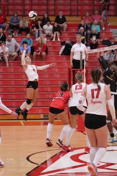 Senior Sophia Sabol jumps to meet the ball in the volleyball teams home match against Avon. The Trojans would win the match 3-1. 