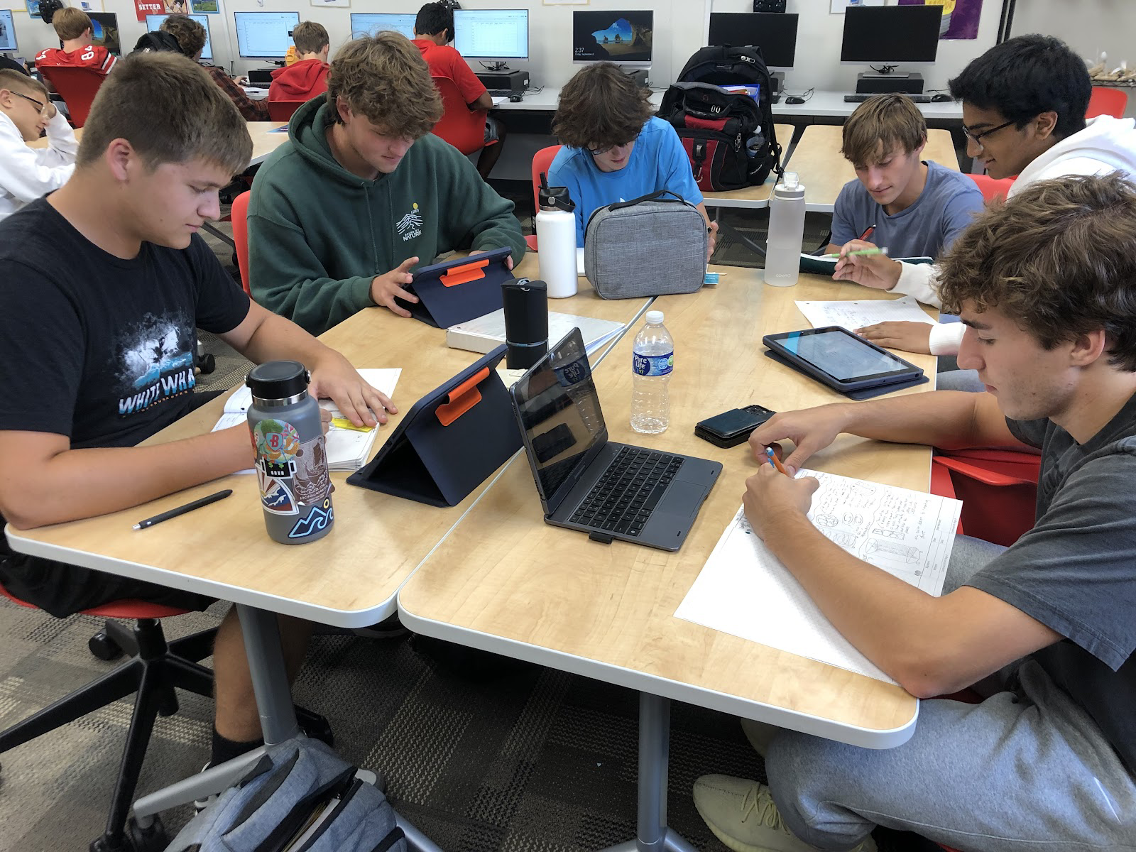 (From the left to right) Seniors Gavin Siems, Cole Gale, Christian Banks, Cameron Kraiger, Manas Kamath and Joey Schmitz work on their collaborative project with Endress+Hauser in Engineering Design and Development.