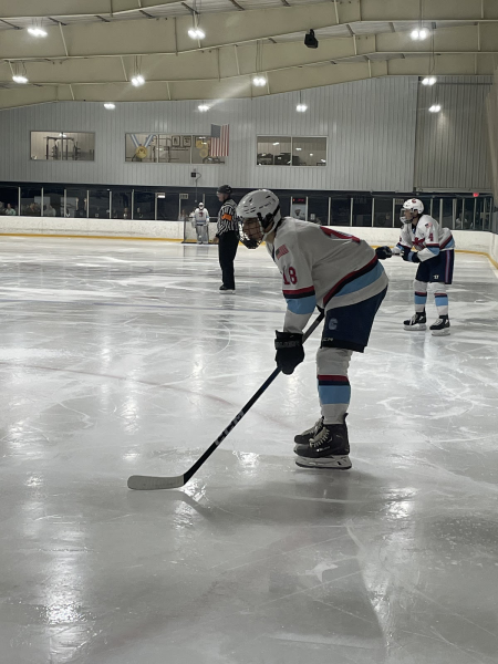 Senior Garrett Bauermeister plays hockey for the Madison Capitals in Wisconsin in hopes to attract better college scouting, which has caused him to attend Center Grove through online classes rather than in-person ones.