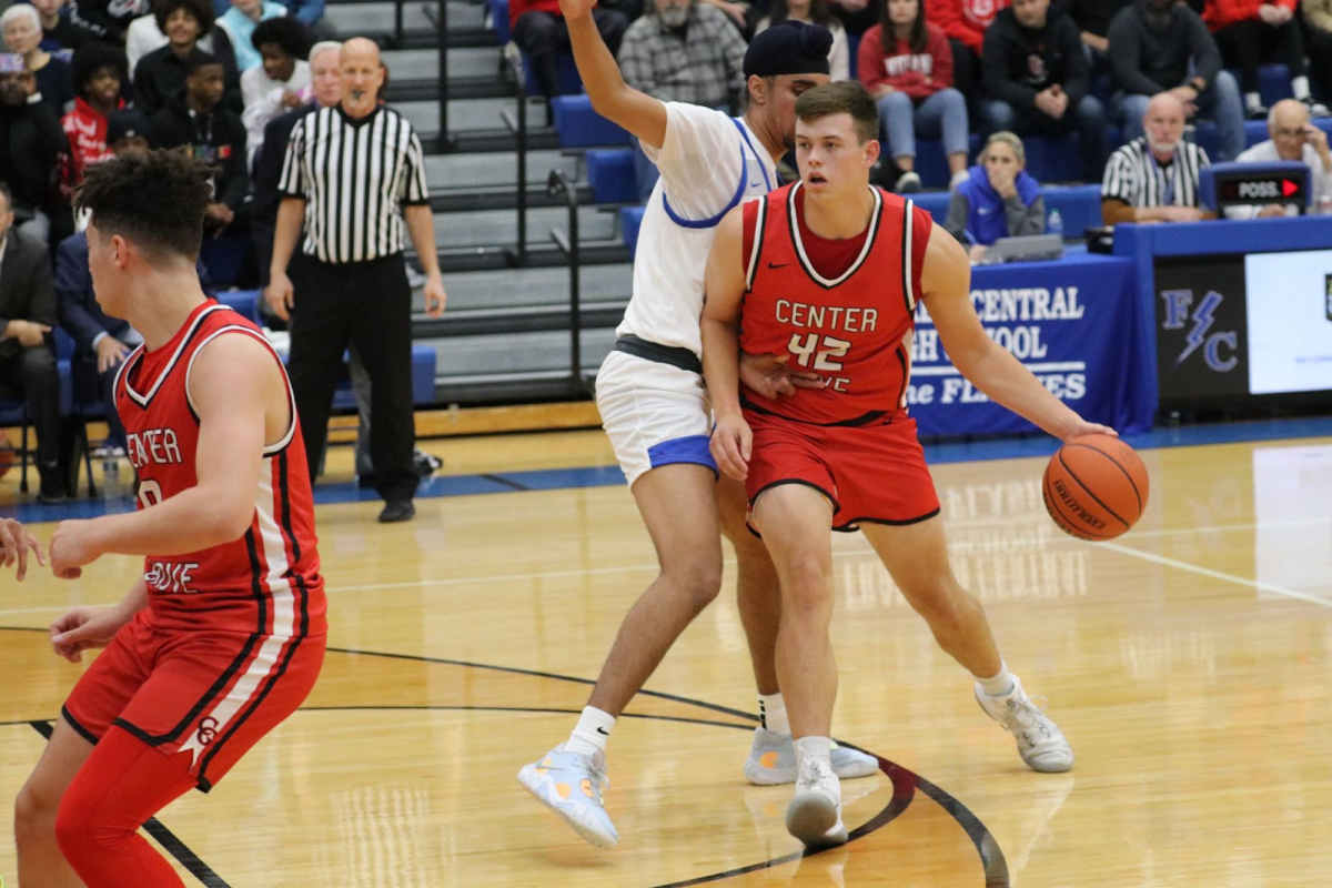 Senior Will Spellman drives the ball during the 2022 game against Franklin Central. The Trojans won the game, 49-46.