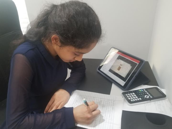 Sophomore Joshitha Neeli completes her math homework.