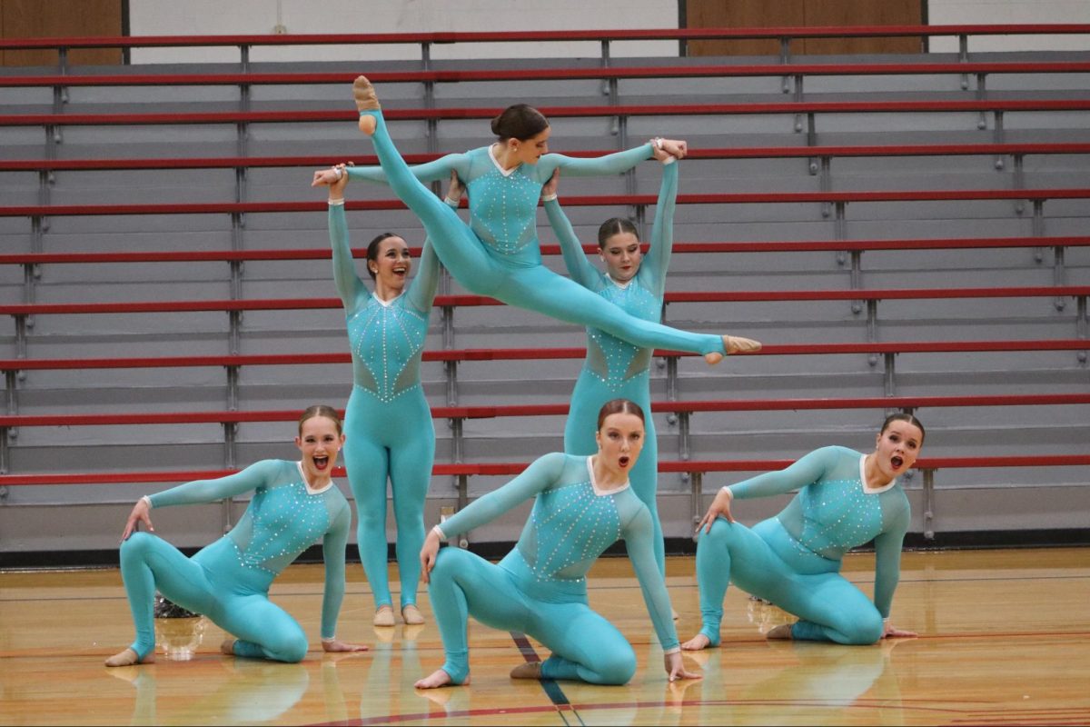 The varsity dance team performs the jazz section of their team performance at their winter showcase. 