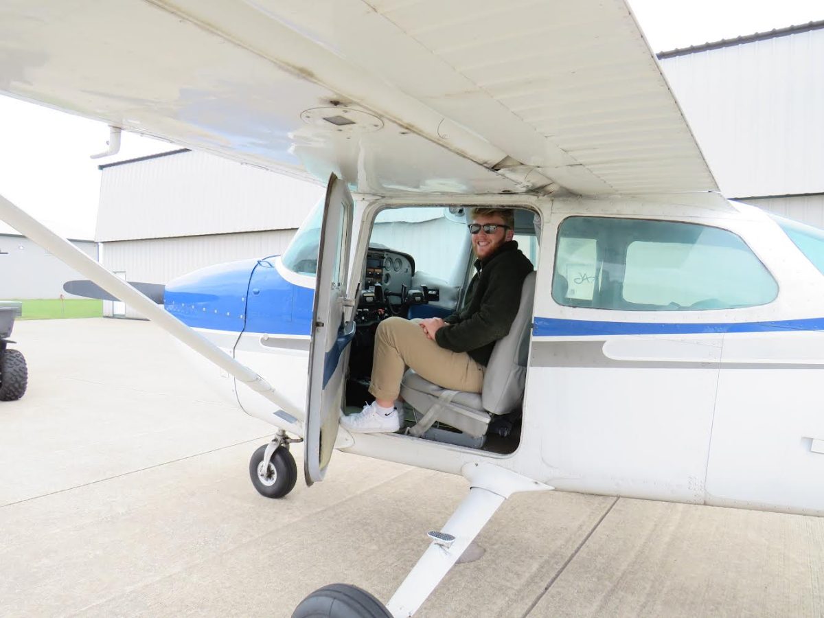 Senior Luke Hobson climbs into a plane during one of his scheduled trainings.