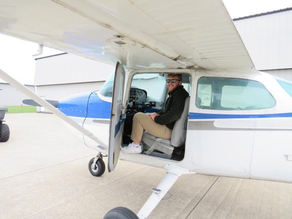 Senior Luke Hobson climbs into a plane during one of his scheduled trainings.
