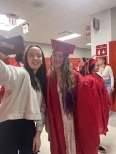 Getting a selfie with a friend, senior Brooke Ward participates in the senior walk. “My favorite part of graduating is being able to go off on a new adventure. High school gave me the tools I needed to gain confidence and exposed me to different types of classes,” Ward said.
