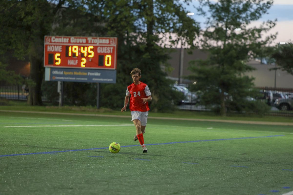 Senior Keaton Barnhizer looks for a pass during the Trojans' 6-0 win this season against Roncalli.