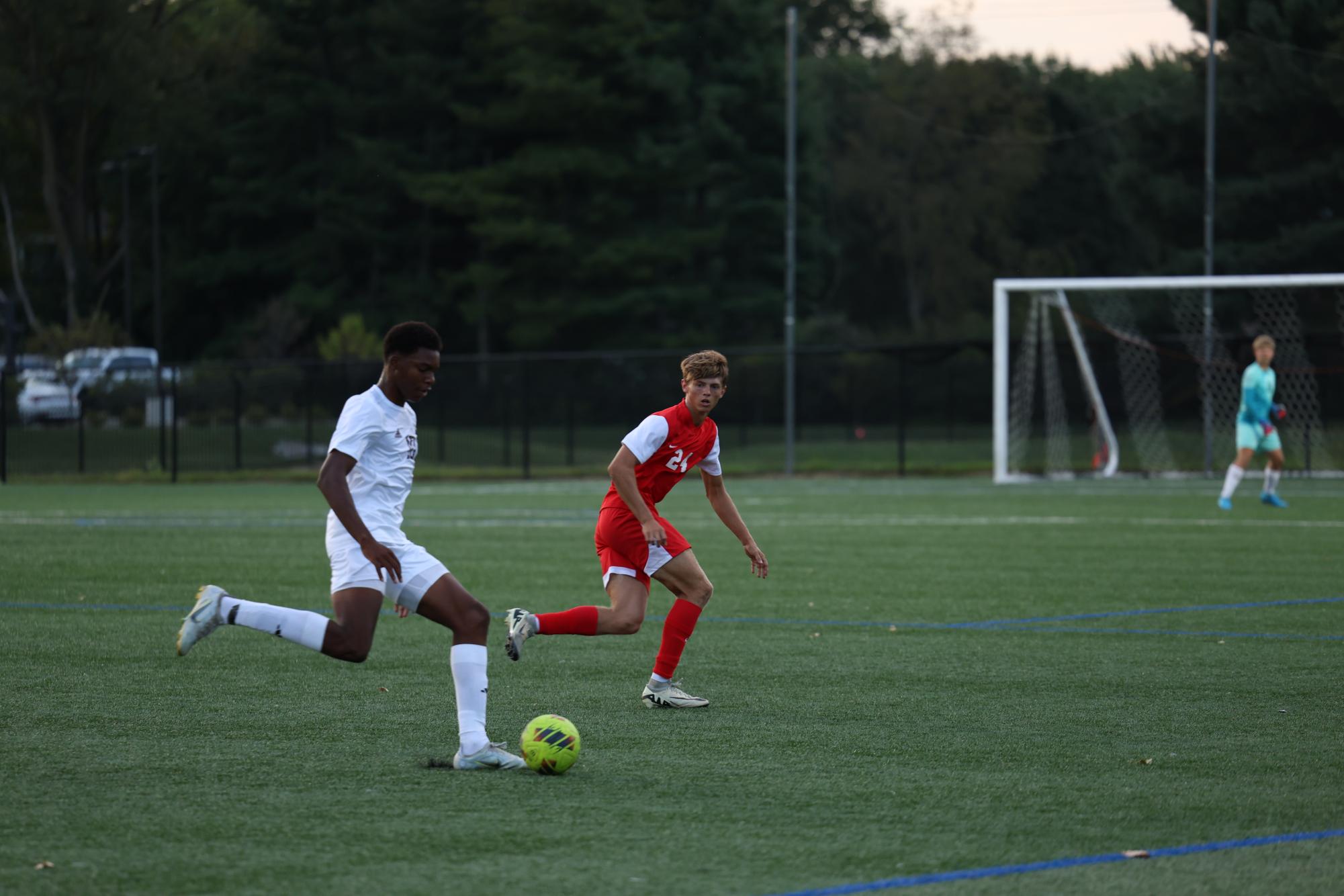 Senior Keaton Barnhizer defends against an attack during the Trojans' 4-0 win against Brebeuf Jesuit this season.