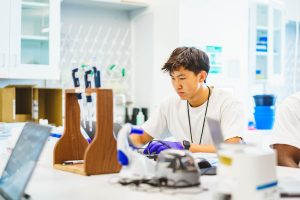 Senior Ryan Zheng works on his biochemistry project during his Summer Science Program at Purdue University. Zheng would collaborate with other participants of the problem to find a solution to the spread of a fungal pathogen.