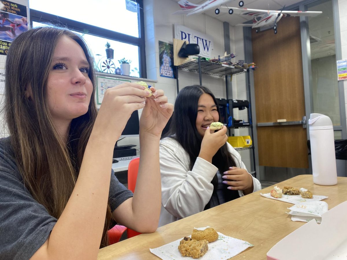 During a STaR party on August 8th, Adalynn Clements ‘26 and Kaia Case ‘26 share a Crumbl Cookies with their classmates and their teacher. They knew their favorite teachers Crumbl cookie, so they wanted to surprise him. “We got Crumbl Cookies to share with our STaR teacher,” Clements said. “We wanted to show our appreciation to our teacher, Mr. Schulz, while having fun with a STaR party.”