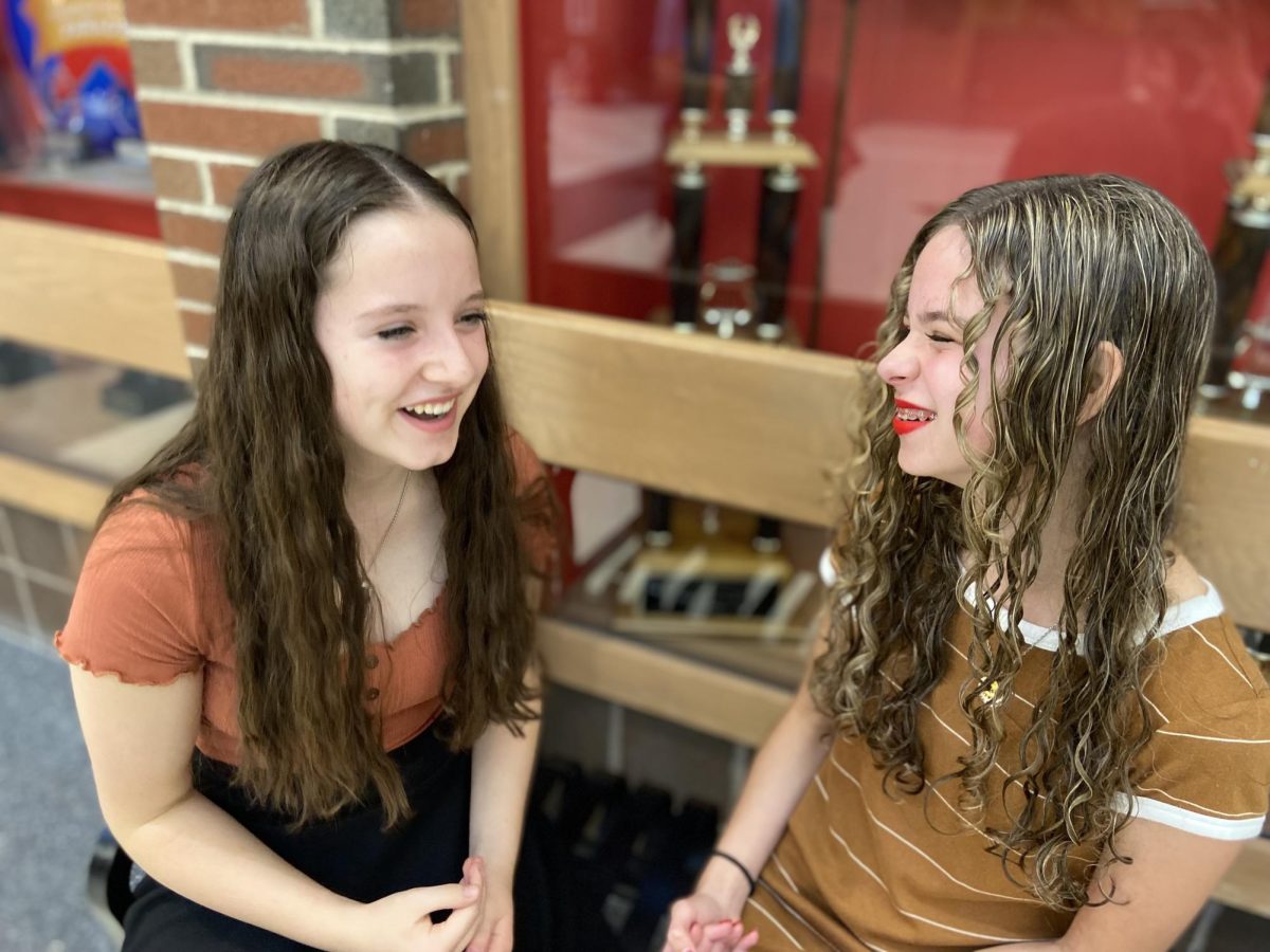 Sophomores Makenzie Wade and Brooke Abernathy hang out in the Hall of Excellence before school. The Hall of Excellence is a place where students can finish homework and socialize with friends before their school day starts. "I enjoy meeting with my friends early before school because it gives me time to relax and prepare for the day,” Wade said. “It gets me excited to go to school.”