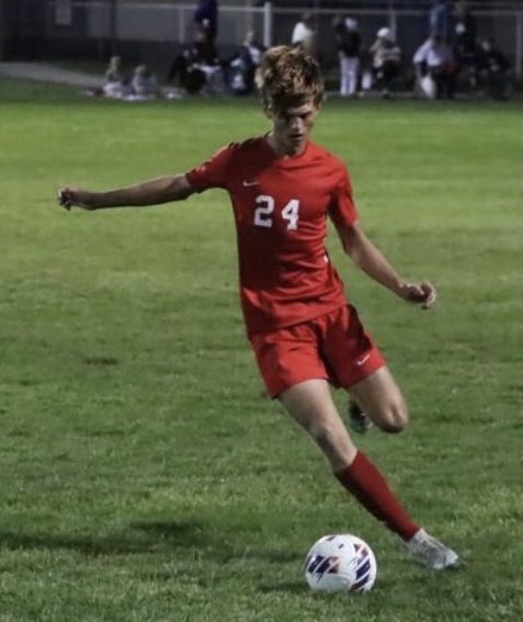 Senior Keaton Barnhizer looks for a pass during the Trojans' 6-0 win this season against Roncalli.