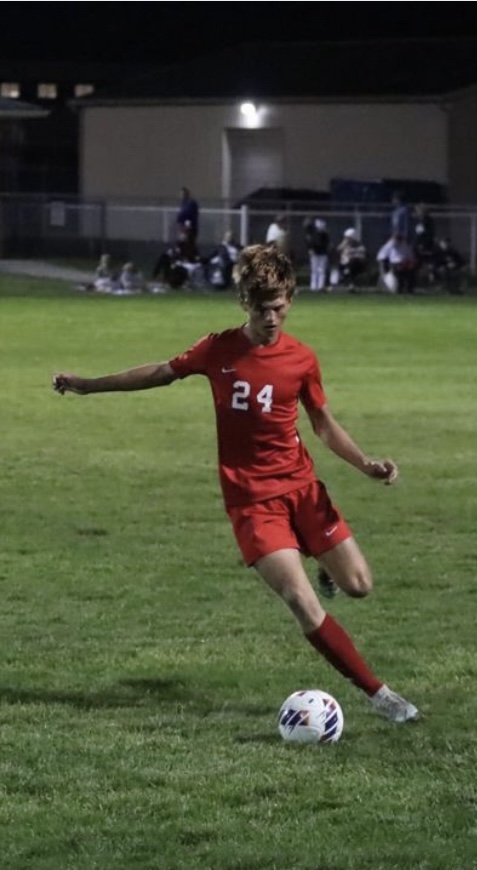 Senior Keaton Barnhizer looks for a pass during the Trojans' 4-0 win against Bloomington North in the sectional semi-final on October 5, 2022. The Trojans would lose Barnhizer in the next match, in their sectional final win against Bloomington South.