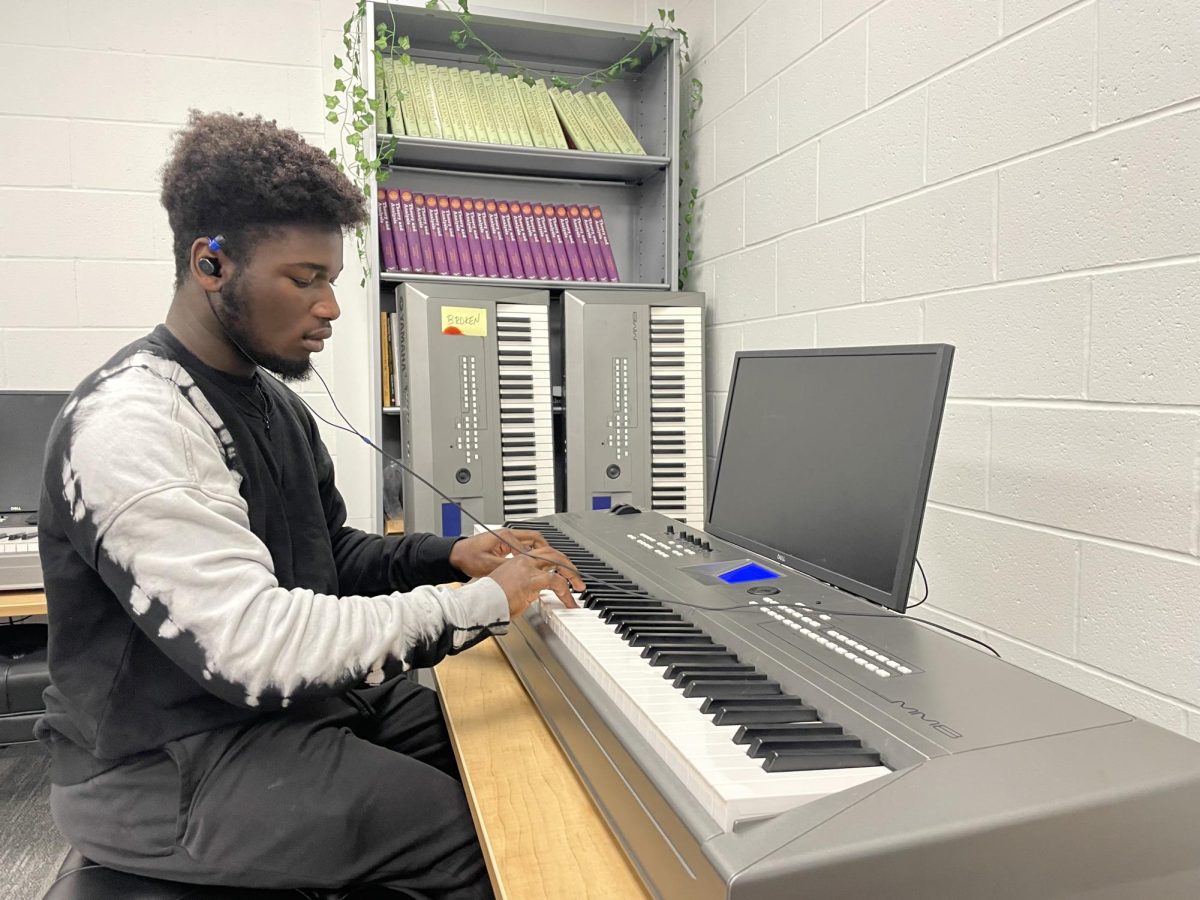 Junior Yoma Ogheneyomn practices the piano during his piano and electric keyboard class, an elective. Students are educated on all levels of piano, perform in front of others and play with other peers. “Piano is a very relaxing class,” Ogheneyomn said. “I would recommend someone to take it because it can further expand your mind and learning."