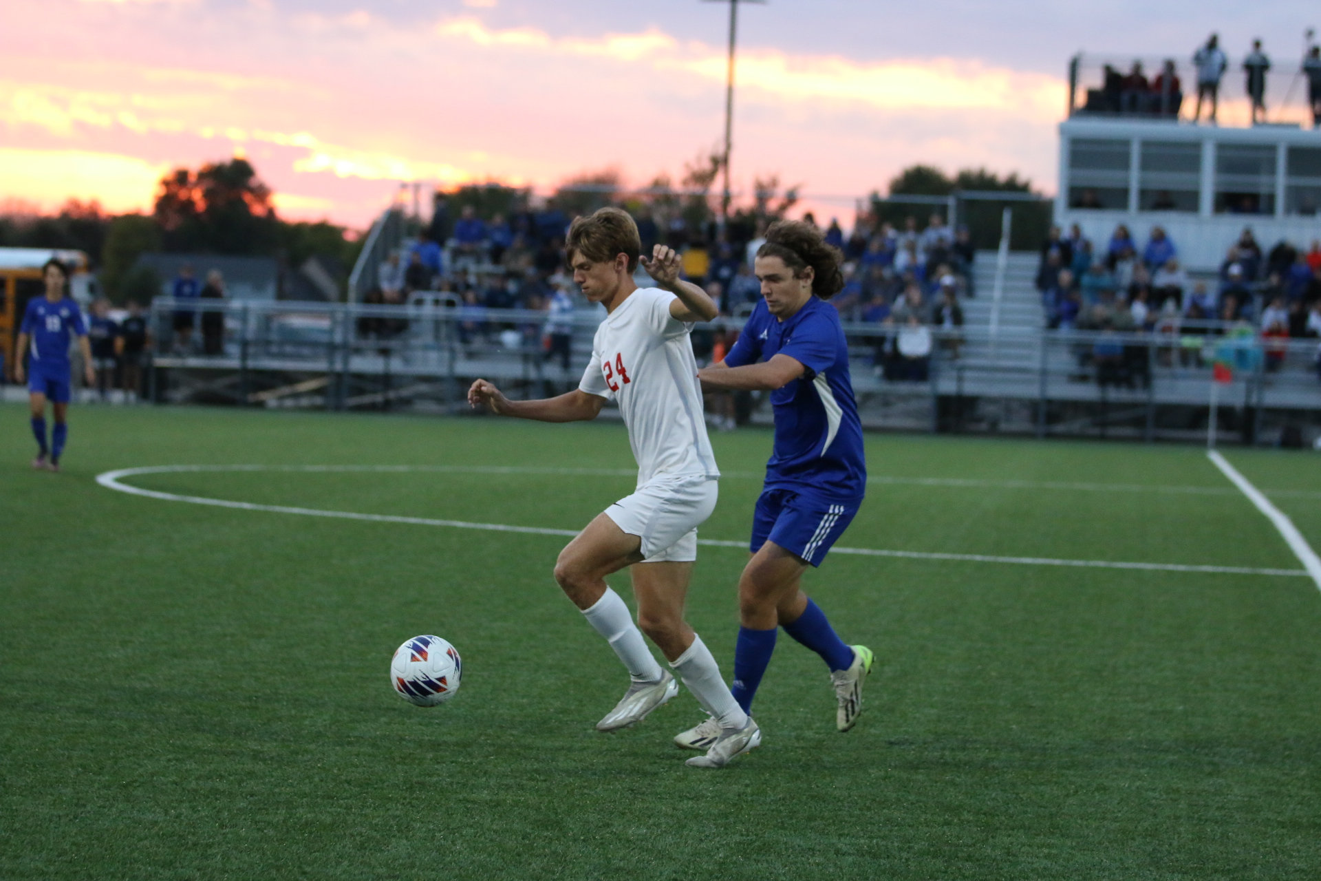 Senior Keaton Barnhizer dribbles out of pressure during the Trojans' 3-2 loss against Columbus North last year in the regional semi-final.