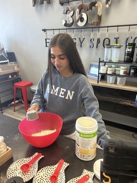 Freshman Esther Greenwood makes peanut butter balls at the Center Grove Energy Spot. “Right now I’m restocking our peanut butter balls. They’re a fun snack to make and a great source for quick protein.” Greenwood has been working at the Energy Spot for two months and says the peanut butter balls are her favorite thing to make. 