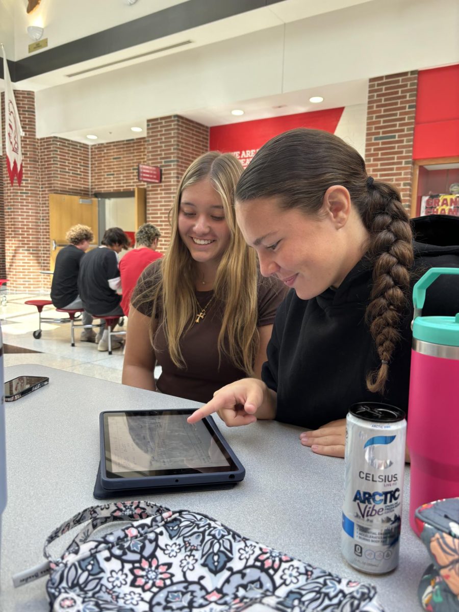 Seniors Maddi Higginson and Addy Richards prepare for their precalculus test during lunch. Many students use lunch as an extra study hall to do homework or study for a test next period. “Addy and I wanted to review math in lunch before our test next period”, Higginson said. “We worked together to make sure we both understood all of the topics from the unit”.